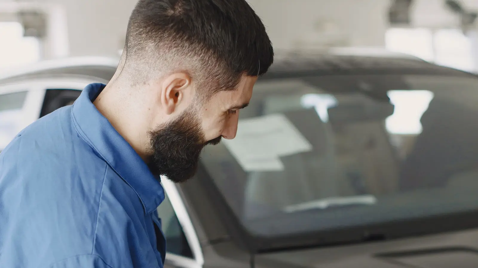 A dual action polisher on a car panel