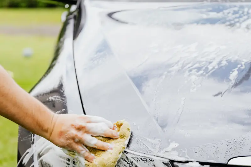 Washing the front of a black car