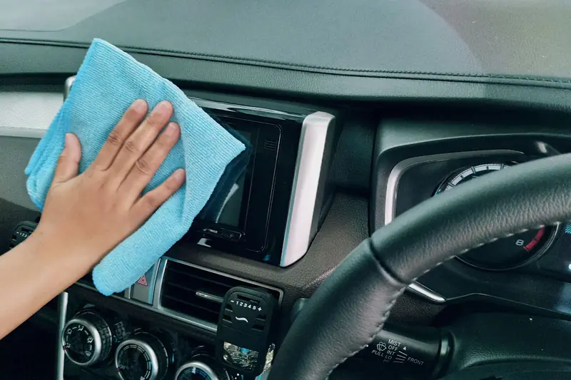 Wiping dust from a dashboard