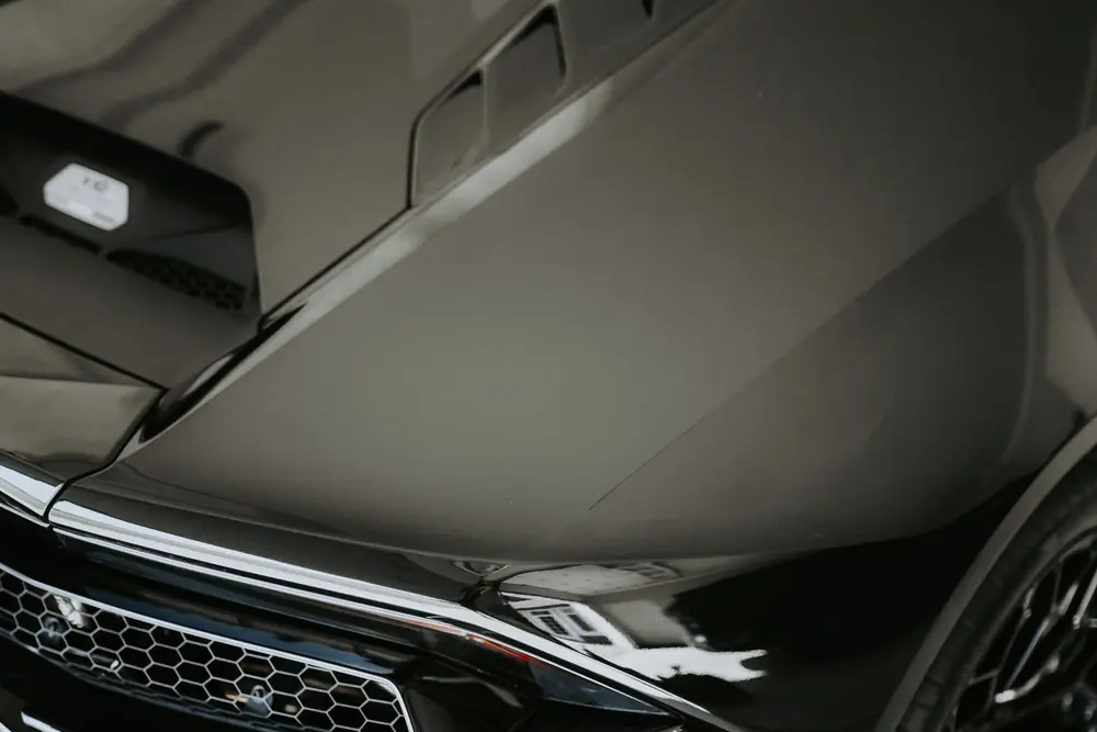Close-up of a glossy black car panel
